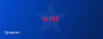 Graphic of a blue box with a star in the middle and the word wins inside