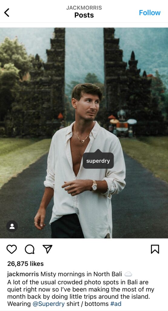 Screenshot of an Instagram post by Jack Morris that is sponsored by the brand Superdry. Jack is standing outside wearing a loose white shirt.
